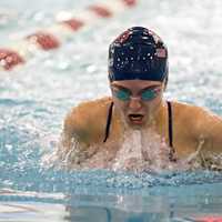 <p>Brooke Collins swims to one of her five victories in the 15-and-over division.</p>