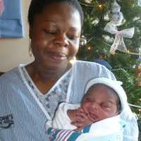 <p>Respy Okang and her newborn son Andrew.</p>