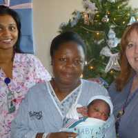 <p>Mom Respy Okang and St. John&#x27;s nurses Kathy Hoffer, right, and Christina Rajan, right, with baby Andrew.</p>