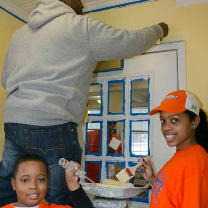 Volunteers paint at the Huguenot Children&#x27;s Library, a branch of the New Rochelle Public Library, at last year&#x27;s MLK Day of Service.
