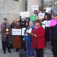 <p>Guisela Marroquin of the Lower Hudson Valley Civil Liberties Union speaks at a rally outside the Westchester County offices in White Plains on police reform.</p>