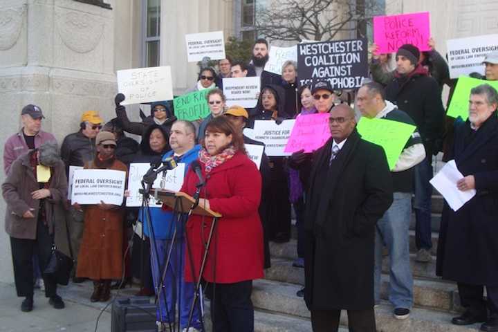 Guisela Marroquin of the Lower Hudson Valley Civil Liberties Union speaks at a rally outside the Westchester County offices in White Plains on police reform.