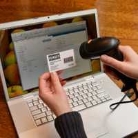 <p>Dana Robertson, of Larchmont, has developed a state-of-the-art barcode system that registers and catalogues the 380 families from Larchmont and Mamaroneck who visit the Food Pantry. </p>