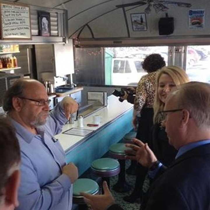 Mark Boughton, right, and Heather Somers greet customers at Norm&#x27;s Diner in Groton.