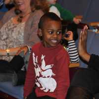 <p>A teacher extends a student a high-five after he busts a move at the Seahawks performance.</p>