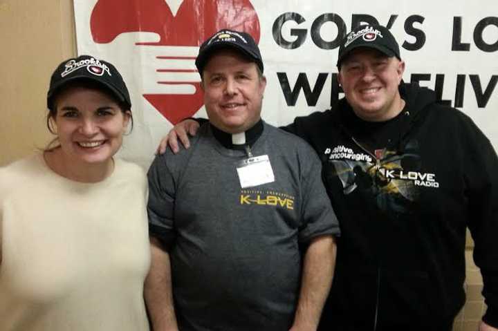 Bronxville Village Lutheran Churchs Vicar Morris Mayer poses with alongside Scott &amp; Kelli of KLove radio after volunteering at a Brooklyn soup kitchen.