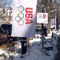 <p>A USA banner flies along a street in Ridgefield.</p>