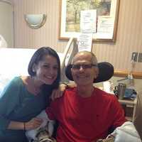 <p>Christina Yackery visits her father while he undergoes rehabilitation at the Westport Health Center.</p>