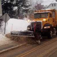 <p>The roads in Danbury look covered in as much sand as snow as a city plow clears during the nor&#x27;easter. </p>