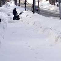 <p>A lone snowblower tackles the drifts Friday morning. </p>