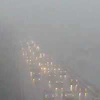 <p>The traffic can barely be seen through the fog Friday afternoon on I-95 at Lockwood Avenue in Stamford. </p>