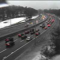 <p>Traffic is slow and the roadway wet on I-95 at the Sherwood Island Connector in Westport on Friday. </p>