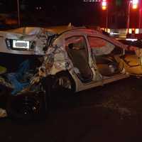 <p>Firefighters had to extricate a woman from the backseat of this Acura after a four-vehicle pileup on I-95 in Norwalk. </p>