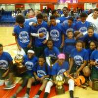 <p>The twin Section 1 champion Woodlands boy and girls teams celebrate together.</p>