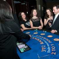 <p>Share the Love attendees enjoying the BlackJack table. From Left to Right: Christina DiMase, Debi Fossati, Jennifer Larkin, Christopher Larkin and Sandra Fink.</p>