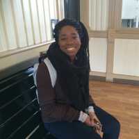 <p>Shaniece Raffington of Stamford, a student at Fairfield University, waits for a train Wednesday afternoon in Fairfield.</p>