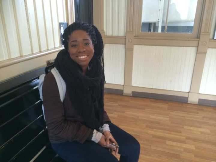 Shaniece Raffington of Stamford, a student at Fairfield University, waits for a train Wednesday afternoon in Fairfield.