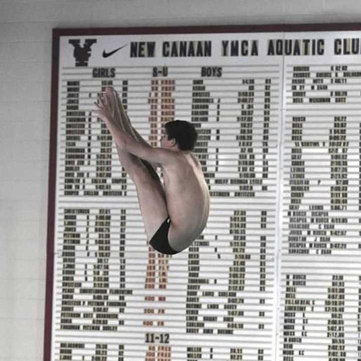 Bobby Ross of New Canaan soars in the pike position.
