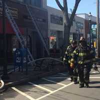 <p>Fairfield firefighters respond to the blaze on the Post Road on Thursday. </p>