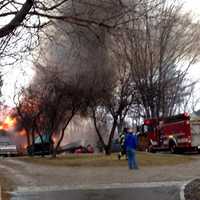 <p>Firefighters respond to the blaze Saturday at 44 Fox Run Road. </p>