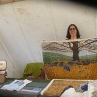 <p>Martha V. North shows off her rugs at Sheep-to-Shawl in Sleepy Hollow.</p>