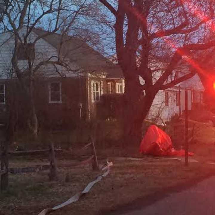 Hazmat and fire crews set up near a house on Clinton Street near Oyster Road in Fairfield on Monday evening. 