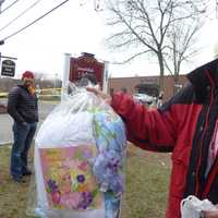 <p>Carolyn Sherwin, a spokeswoman for the American Red Cross, shows a care package given to a four-year-old displaced by a fire. </p>