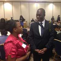 <p>Donnovan Beckford (center) is the director of the Workforce Investment Board.</p>