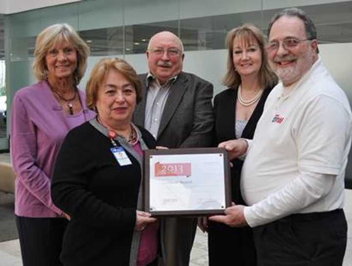 Accepting the 2013 Top 100 Host award from AARPs Frank Pagerino, district coordinator, and Phil Swan, instructor, are Lyn Linz, Bridgette Lundgren-Foscante and Kathy Carley-Spanier, Community Health at Greenwich Hospital.