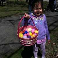 <p>Sofia Frascatore, 4, holds up the eggs she found at the 10th Annual Heckscher Farm Easter Egg Hunt on Saturday.</p>