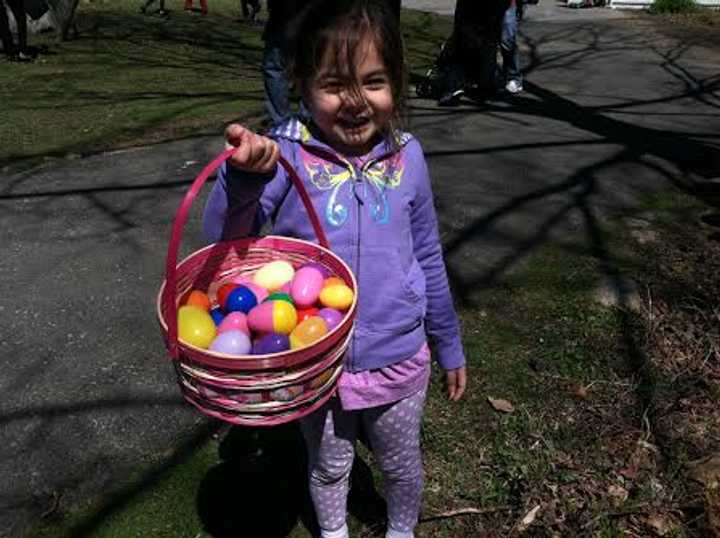 Sofia Frascatore, 4, holds up the eggs she found at the 10th Annual Heckscher Farm Easter Egg Hunt on Saturday.