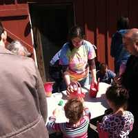 <p>Children turn in the plastic eggs they found at the 10th Annual Heckscher Farm Easter Egg Hunt on Saturday in Stamford.</p>