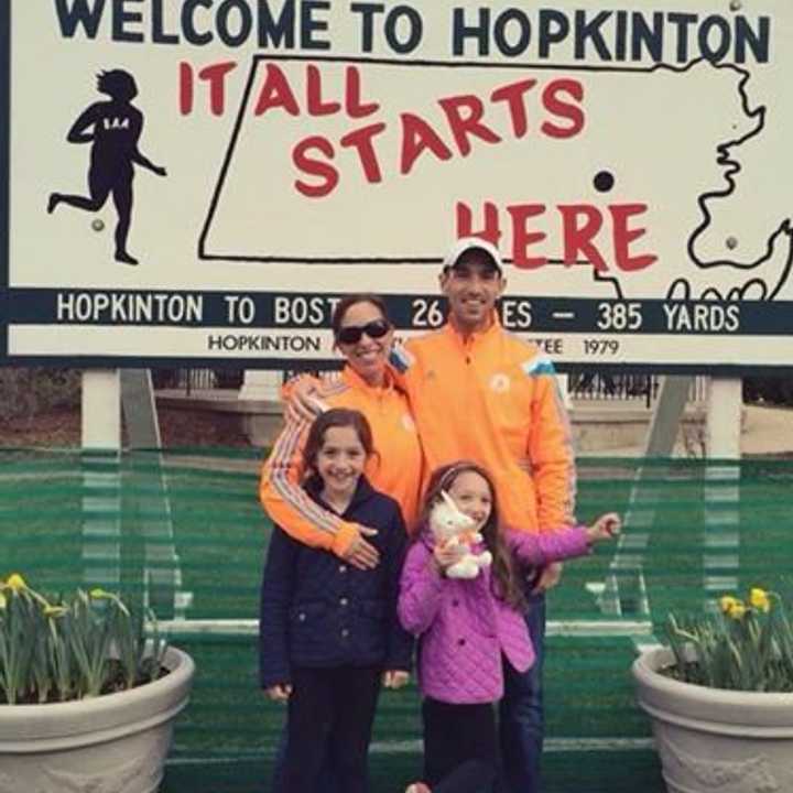 James and Shannon Whipple of Norwalk stand near the starting line for the Boston Marathon in Hopkinton, Mass. The Whipples will be among the area runners in Monday&#x27;s race.