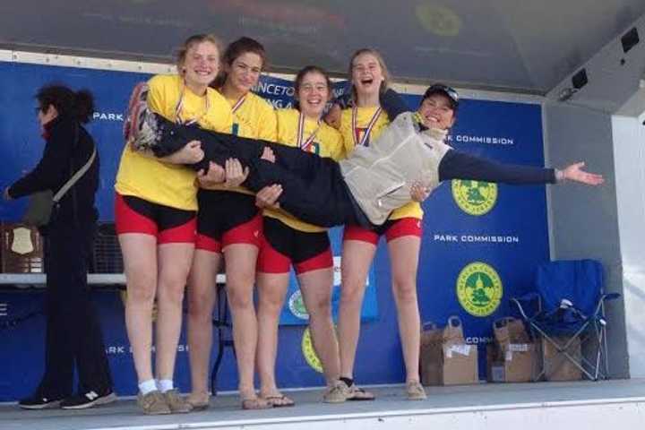 Maggie Owen, Tate Aronstein, Siobhan Naughton and Kim Dyrvik with coach Anna Cherednikova, celebrate a gold medal in the Novice 4x.