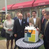 <p>(L to R) Ellen Lynch, Brooks Shopping Center representatives, Kevin Plunkett, Mike Spano and Michael Sabatino cut the cake. </p>