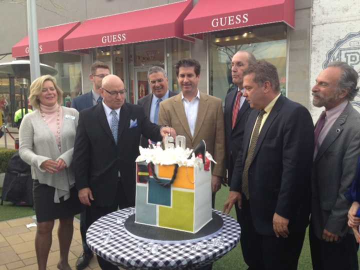 (L to R) Ellen Lynch, Brooks Shopping Center representatives, Kevin Plunkett, Mike Spano and Michael Sabatino cut the cake. 