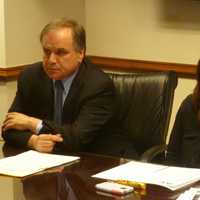 <p>Westchester County Clerk Timothy Idoni, left, and Westchester Residential Opportunities In. director Veronica Raphael talk about the spike in foreclosures in 2013 and 2014. </p>