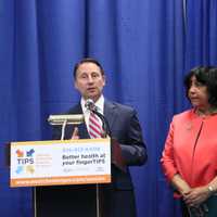 <p>Westchester County Executive Robert P. Astorino explains the new Telehealth Intervention Programs for Seniors (TIPS) as Commissioner Mae Carpenter listens.</p>