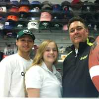 <p>Pat Cecio, right, owner of All-Apparel Sports in Old Greenwich and his children William, 18, and Nicole, 16, stand in the store. Cecio says he only stocks Giants, Jets and Patriots jerseys and has no plans to add Manziel and Sam jerseys.</p>