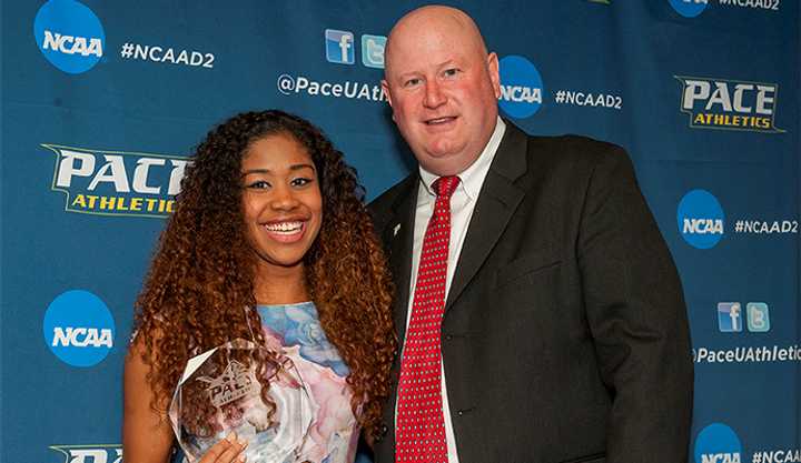  Darrell Halloran Memorial Award Recipient Kaitlyn Lynch and Director of Athletics Mark Brown.