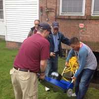 <p>Volunteers from Norwalk&#x27;s Knights of Columbus help to clean out the basement of the Notre Dame Convalescent Home recently.</p>