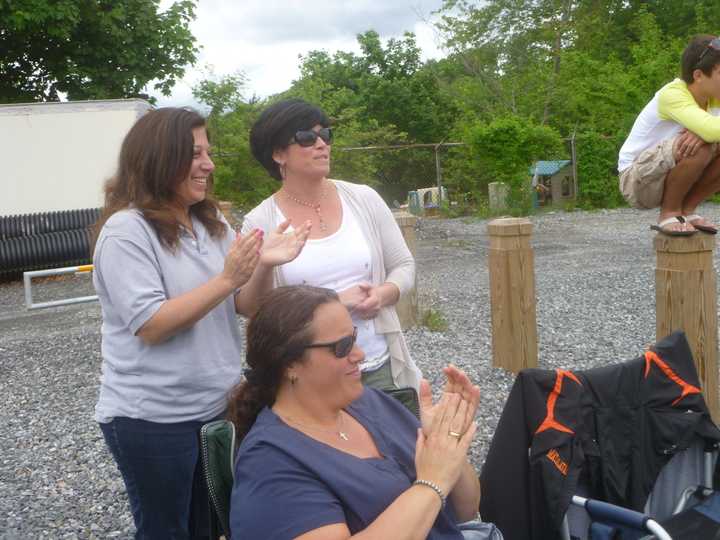 Croton moms cheer on their team.