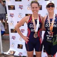 <p>Greenwich&#x27;s Amy Dixon, right, stands with guide Caroline Gaynor after finishing third Sunday in her division of the Pan American Triathlon Confederation paratriathlon championships.</p>