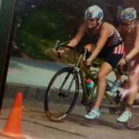 <p>Amy Dixon, right, and Caroline Gaynor ride on the bike during the race. </p>