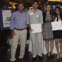 <p>Latino U honorees pose with Michael Kaplowitz, who presented them with a certificate of merit. </p>