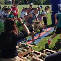 <p>The first wave of runners leaves the starting line at the Pineapple Race. </p>