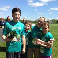 <p>Spencer Lovely, William Lovely, Caitlyn Lovely and Katie Nedder celebrate after the race. </p>