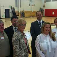 <p>Companies that sponsor programs at the newly reopened J.M. Wright Technical School get a tour Tuesday. From left in the gym are: Tom Regan, Raymond Mencio, Judy Resnick, Dan Smith, Laura Varrone, Meredith Keiling and Pat Ciarleglio.</p>