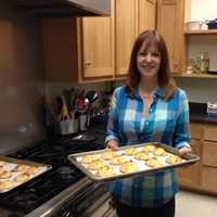 <p>Denise Mickelsen of Danbury, a senior editor at Fine Cooking magazine, makes cookies for the Cookies for Kids Cancer bake sale. </p>