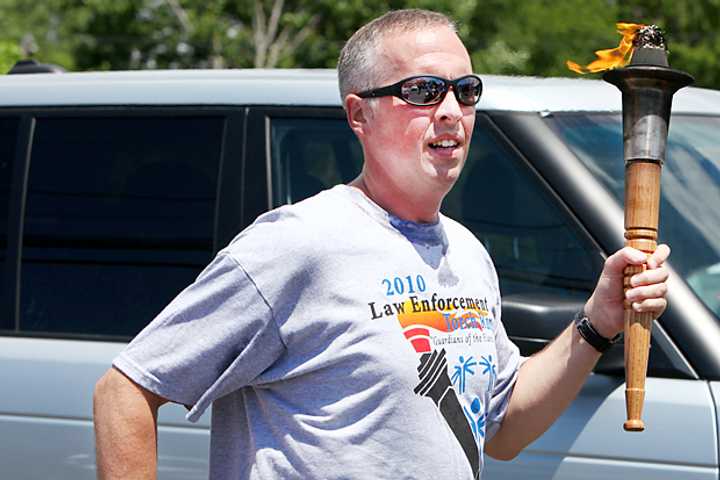 A runner carries the Special Olympics torch in a past event.